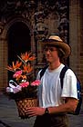 Photographer carrying flowers